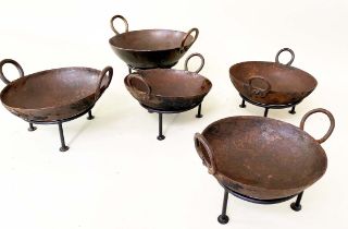 INDIAN STYLE KADAI FIRE BOWLS ON STANDS, a set of five, 46cm diam. at largest, of various sizes. (5)