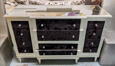 BANK OF DRAWERS, 140cm x 55cm x 87cm H, the antiqued mirrored top on a base in a silvered finish