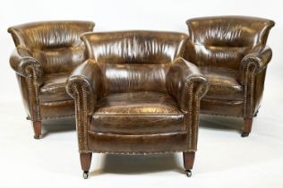 LIBRARY CLUB ARMCHAIRS, a set of three, Edwardian style studded tan leather with square tapering