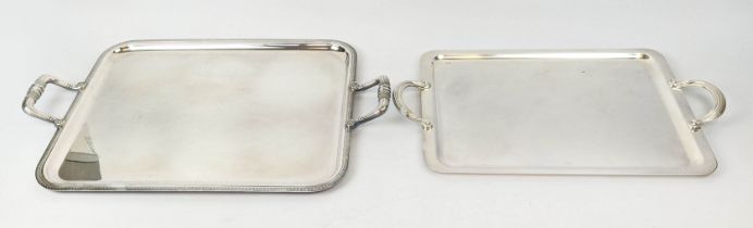 TWO CHRISTOFLE SILVER PLATED TWIN HANDLED SERVING TRAYS, largest 60cm x 39cm, complete with cloth