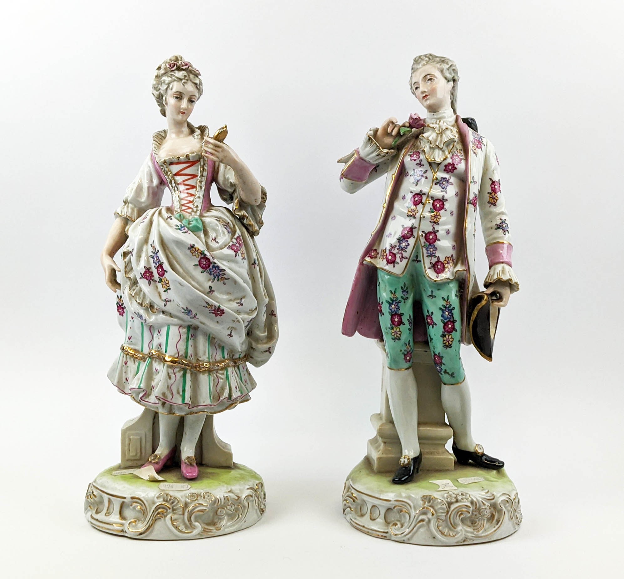 PORCELAIN FIGURE, Dresden style, modelled as a gentlemen dandy with rose and a lady with mirror,