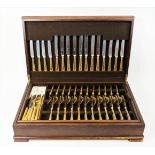 A GARRARDS CASED CANTEEN OF CUTLERY, circa 1980, Louis XVI pattern hard gold-plated cutlery,