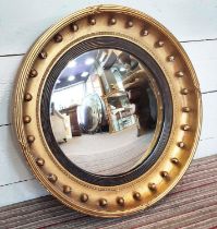 CONVEX MIRROR, 68cm W, 19th century giltwood, with ball and reeded detail.