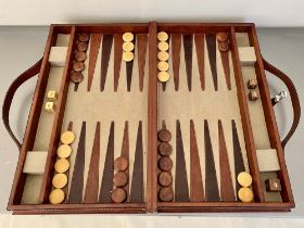 BACKGAMMON SET, in tan leathered case, 7cm x 23cm x 40cm.