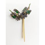 YELLOW METAL HAT PIN, in the form of birds on a branch, green jade and blue silk thread