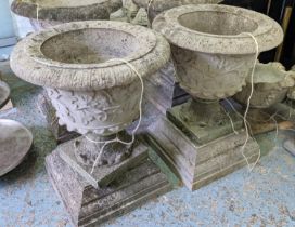 GARDEN URNS, a pair, each 66cm W x 85cm H, in weathered reconstituted stone. (2)