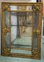 WALL MIRROR, 81cm W x 115cm H, early 19th century Continental, the gilt frame with bevelled