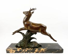 A SOLEALL BRONZE DEER, Art Deco on black variegated marble base, 52cm L x 41cm H.