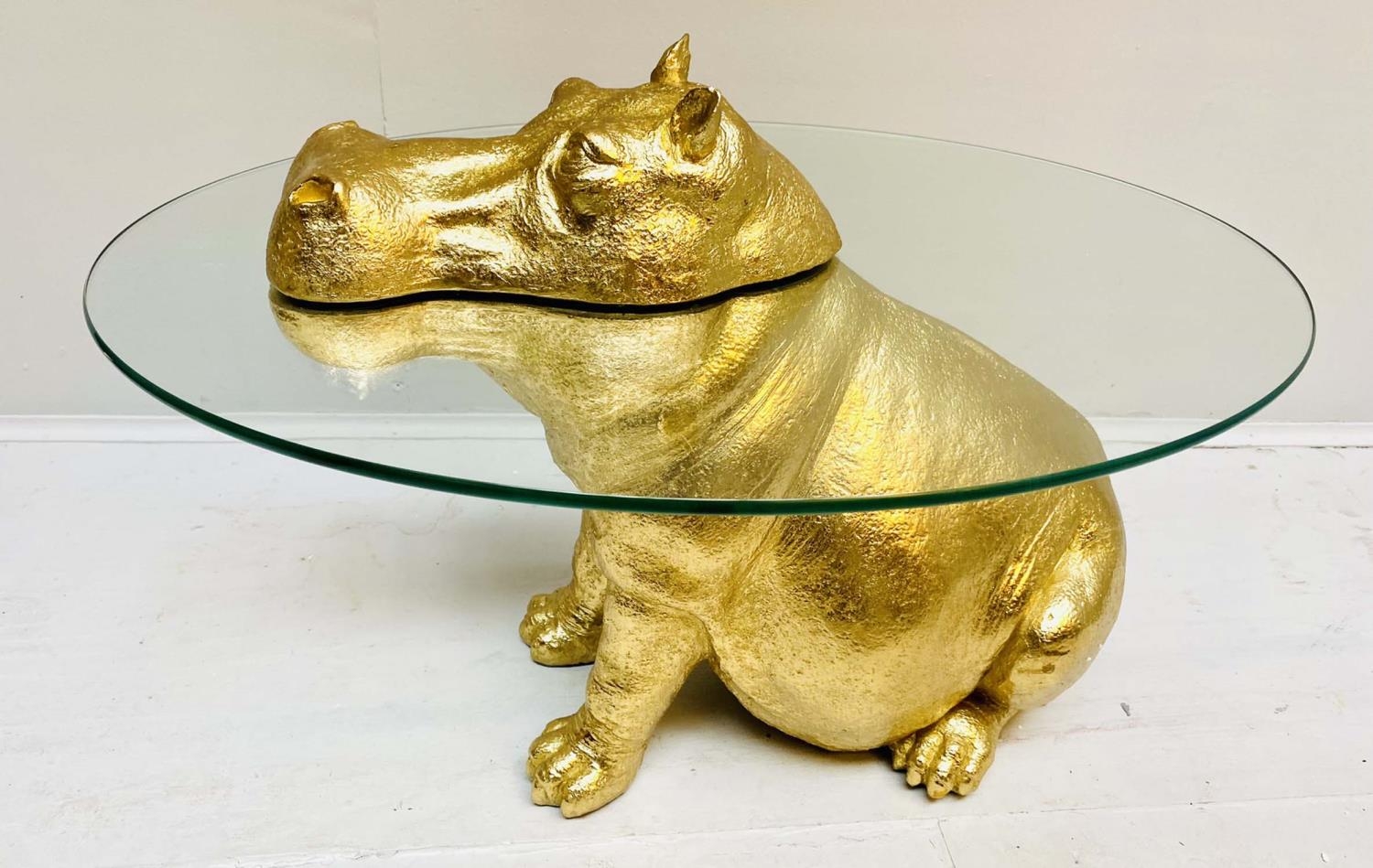 HIPPOPTAMUS LOW TABLE, 65cm x 50cm x 45cm, gilt finish to body, glass top.