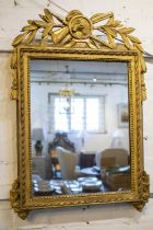 WALL MIRROR, French Louis XVI giltwood with boars head surmount and rectangular plate, 70cm x 48cm.