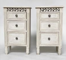 BEDSIDE CHESTS, a pair, French style grey painted each with three drawers and pierced frieze, 40cm x