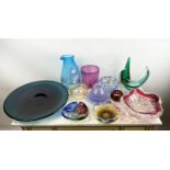 COLLECTION OF STUDIO ART GLASS, twelve varies pieces including a blue carafe and charger, 42cm diam.