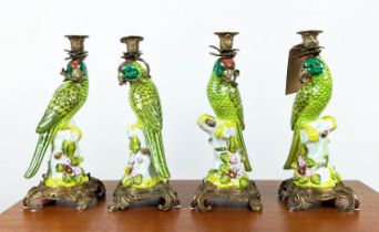 CANDELABRA, a set of four, in the form of parrots, glazed ceramic with gilt mounts, 35.5cm H