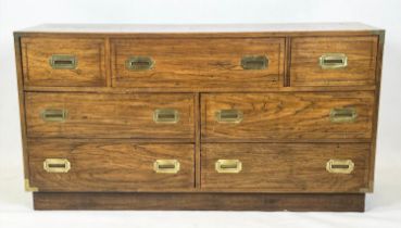 LOW CHEST, campaign style with an arrangement of seven drawers, 74cm H x 143cm W x 46cm D.