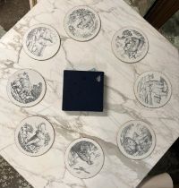 STUART DEVLIN PLACE MATS, a boxed set of eight depicting various animals, each 23cm diam. (8)