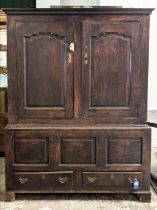 PRESS CUPBOARD, 140cm W x 53cm D x 188cm H, early 18th century oak, with a pair of panelled doors
