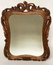 WALL MIRROR, Italian style chantilly gilded deep scrolling frame and shaped bevelled mirror plate,