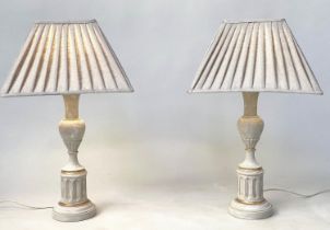 TABLE LAMPS, a pair, French style parcel gilt with turned columns and square pleated linen shades,