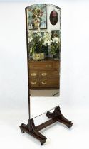 CHEVAL MIRROR, late 19th century mahogany with a bevelled plate, raised on brass castors, 188cm H