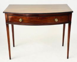 BOWFRONT WRITING TABLE, George III period figured mahogany with full width frieze drawer and