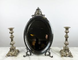 OVAL DRESSING TABLE MIRROR, silver plated with bevelled plate and a pair of plated candlesticks,