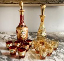 LIQUOR SET, Murano ruby and amber each with decanter and six glasses, (one labelled 'Murano', one