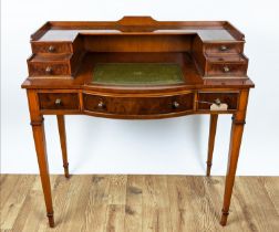 WRITING DESK, yewwood with tooled leather insert and an arrangement of seven drawers, 93cm H x