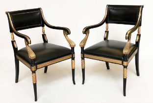 ARMCHAIRS, a pair, Regency style lacquered and gilded with leather seats, scroll arms and swept