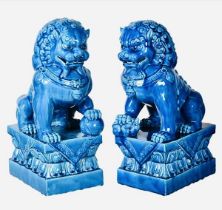 FOO DOGS, a pair, 40cm high, 15cm wide, 25cm deep, cobalt blue glazed ceramic. (2)