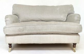 HOWARD STYLE SOFA, with natural linen upholstery, feather filled cushions and turned front supports,