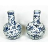 CHINESE BLUE AND WHITE VASES, a pair, painted with dragons chasing the flaming pearl of wisdom, 63cm