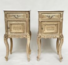 BEDSIDE CABINETS, a pair, early 20th century French Louis XV style oak each with drawer and carved