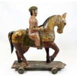 MUGHAL SCHOOL,RAJASTHAN, INDIA 'Horse and rider', polychrome painted carved wood, 109cm H.