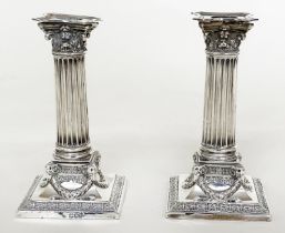 CANDLESTICKS, a pair, silver Corinthian column and swag square bases, London 1892, 17cm H. (2)
