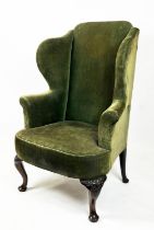 WING ARMCHAIR, 19th century walnut in old green corduroy (discoloring and marks to upholstery)