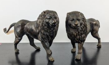 CONTEMPORARY SCHOOL SCULPTURAL LIONS, a pair, cast metal, 45cm x 10cm x 25cm each. (2)