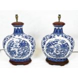 CHINESE MOONFLASK LAMPS, a pair, decorated with a five claw dragon chasing the flaming pearl of
