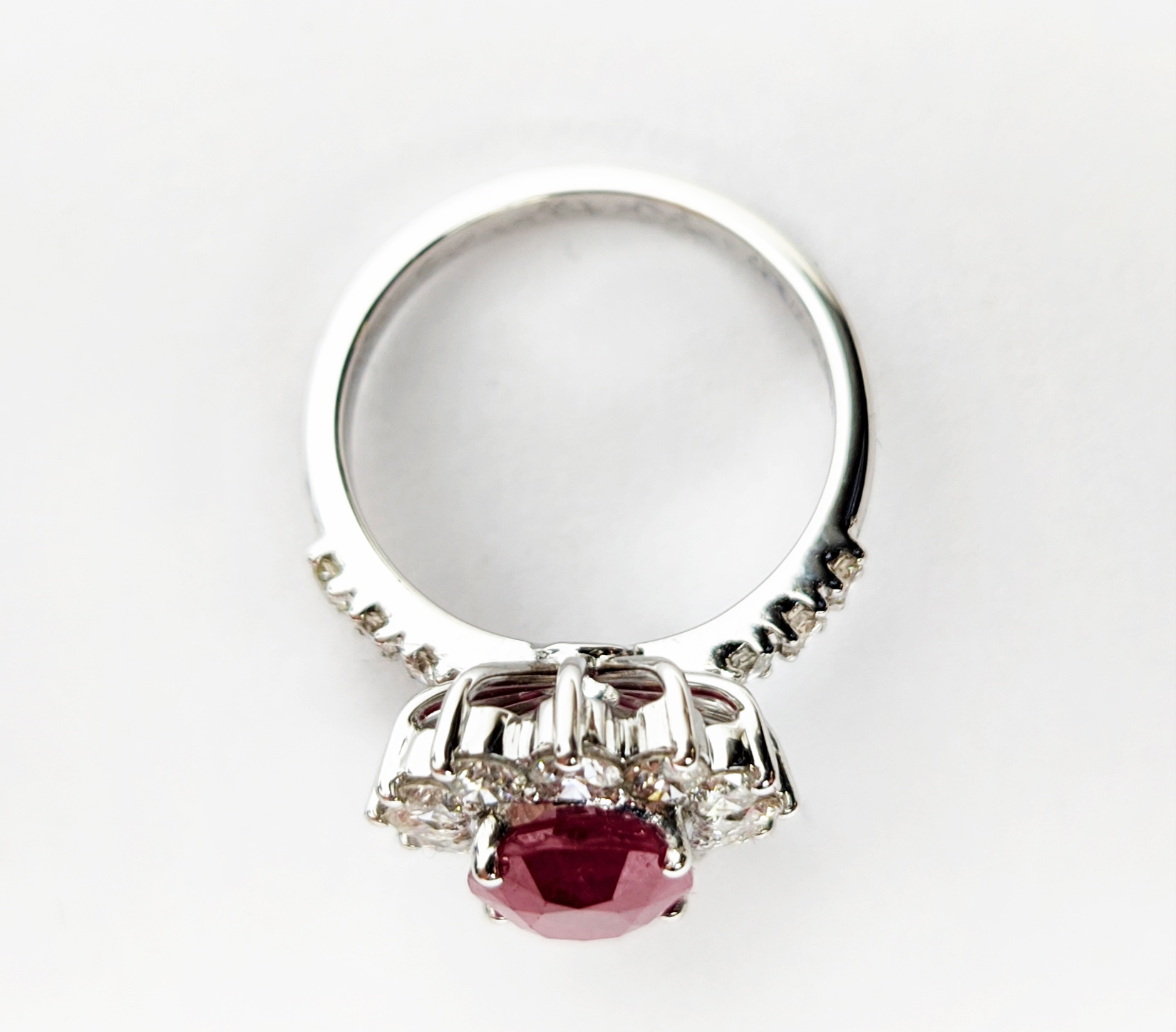 AN 18CT WHITE GOLD RUBY AND DIAMOND CLUSTER RING, with diamond set shoulders, the central oval cut - Image 5 of 10