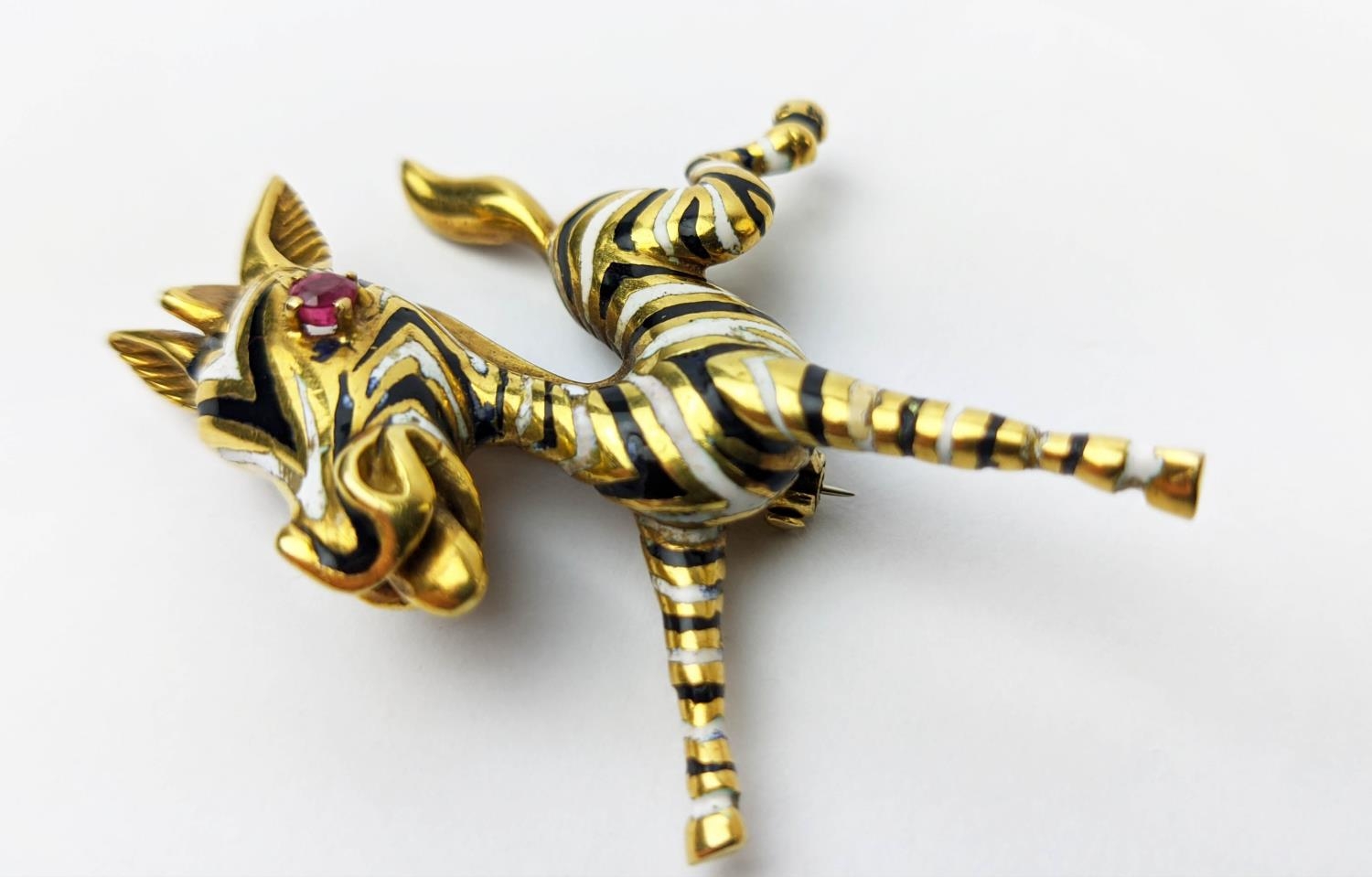 AN 18CT GOLD FAWN BROOCH, enamelled body, set with a ruby eye, 20.66 grams. - Image 6 of 8