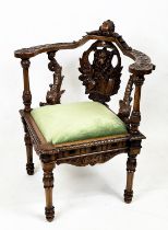 CORNER CHAIR, 86cm H x 71cm, mid 19th century Continental carved walnut with green velvet seat.