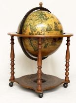 GLOBE COCKTAIL CABINET, in the form of an antique terrestrial globe on stand with rising lid and