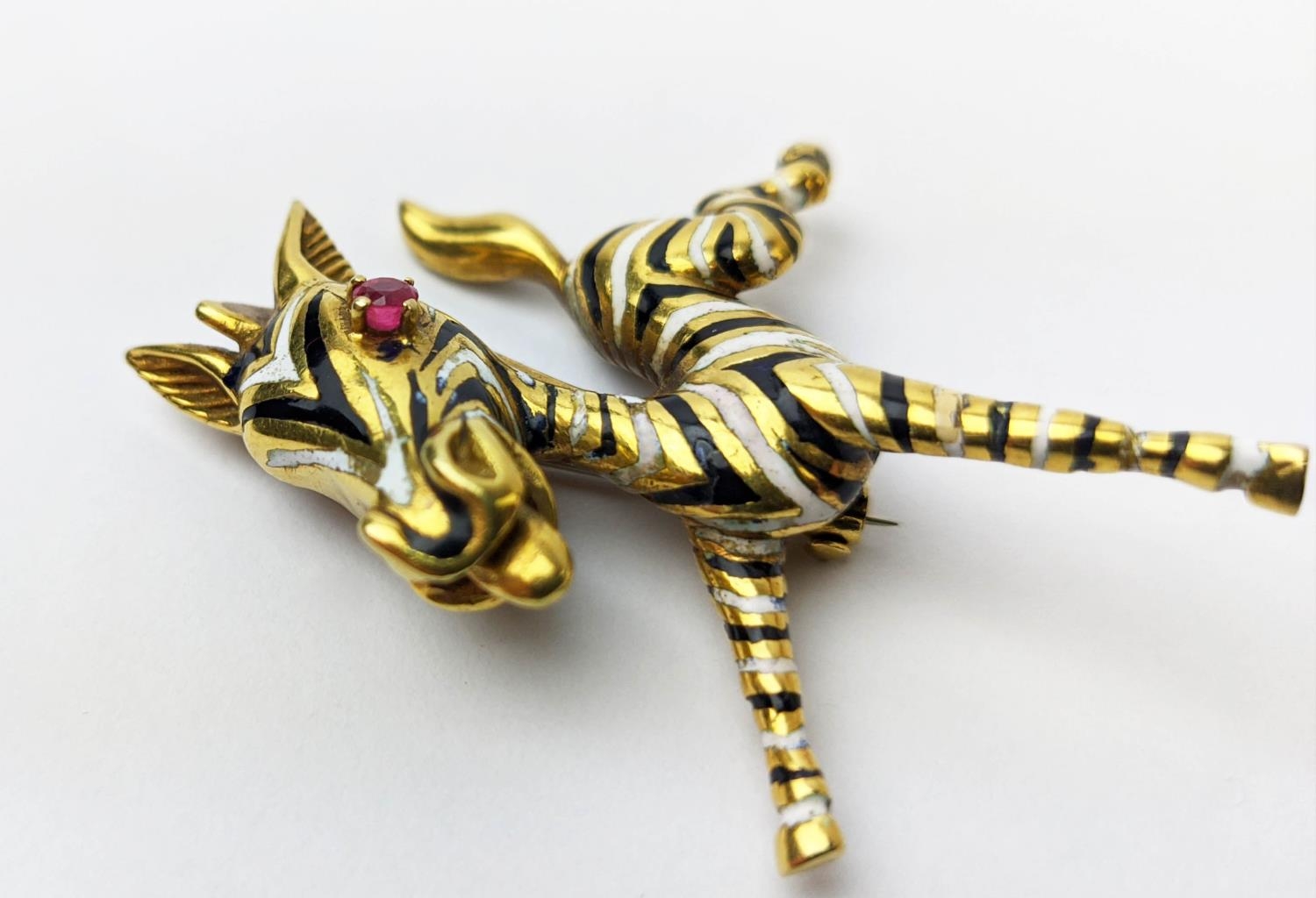 AN 18CT GOLD FAWN BROOCH, enamelled body, set with a ruby eye, 20.66 grams. - Image 5 of 8