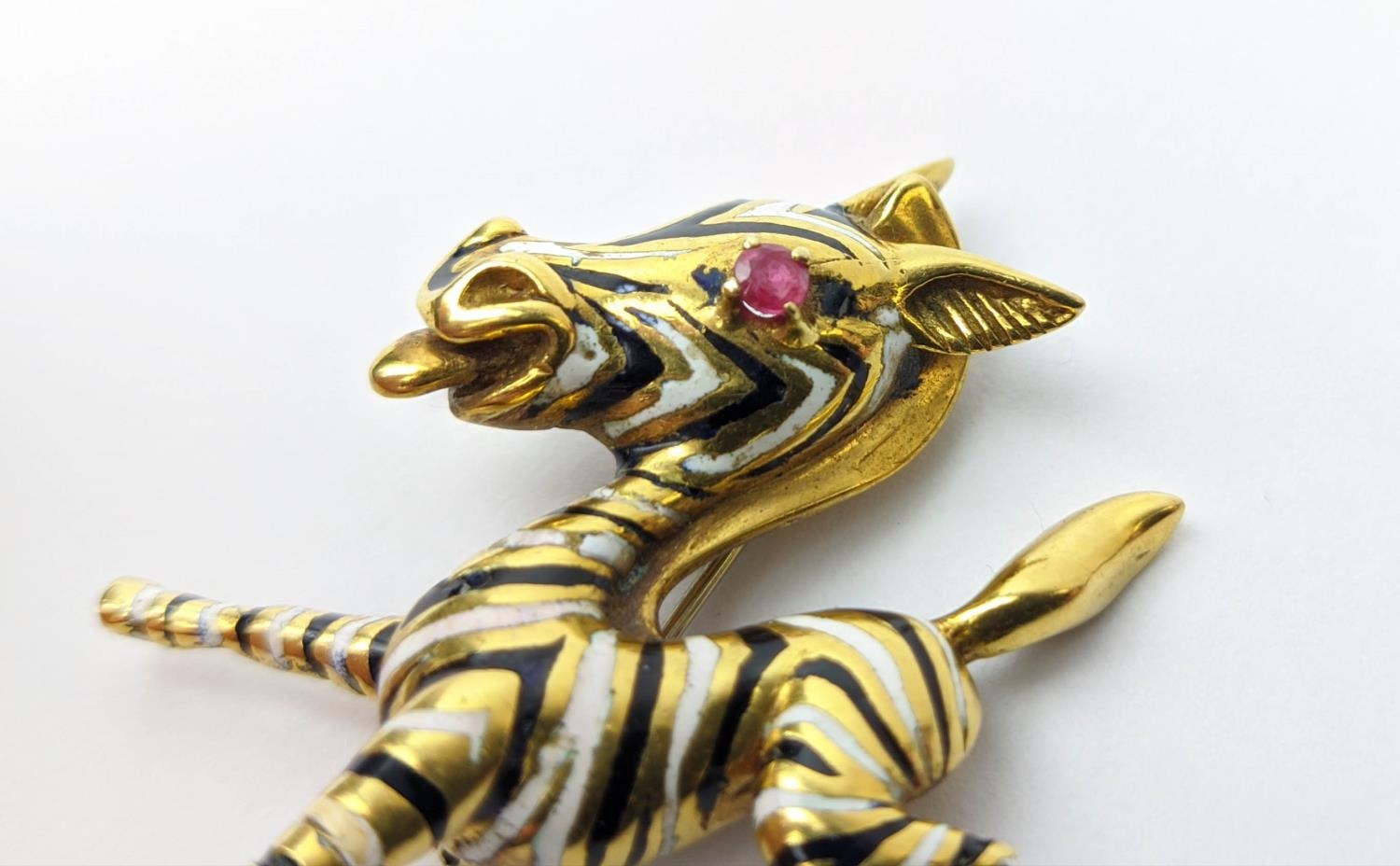AN 18CT GOLD FAWN BROOCH, enamelled body, set with a ruby eye, 20.66 grams. - Image 7 of 8