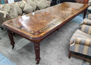 EXTENDABLE DINING TABLE, walnut with inlay decoration, four leaves on reeded supports with