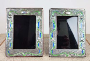 PHOTO FRAMES, a pair, Art Nouveau style design, polished metal with coloured detail, stand at 17.5cm