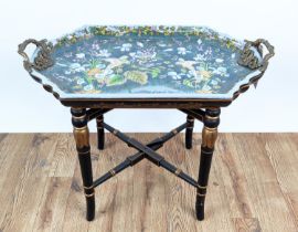 TRAY TABLE, glazed ceramic tray top, gilt handles, on black and gilt painted wood base, 73.5cm x