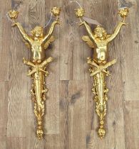 WALL LIGHTS, a pair, 74cm each French Rococo style, cherub form, gilt finish. (2)