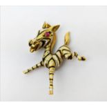 AN 18CT GOLD FAWN BROOCH, enamelled body, set with a ruby eye, 20.66 grams.