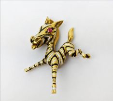 AN 18CT GOLD FAWN BROOCH, enamelled body, set with a ruby eye, 20.66 grams.