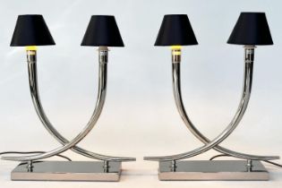 TABLE LAMPS, a pair, chrome each with interlocking 'horns' on chromium plinths by RV ASTLEY, 56cm